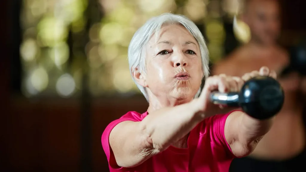 Toning Bingo Wings: Effective Exercises and Tips for Achieving Sleeker Arms 2 Person performing arm exercises with dumbbells Wivenhoe