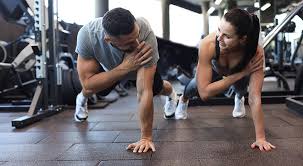 Image of man and woman doing Cardio Wivenhoe to tone their arms. 